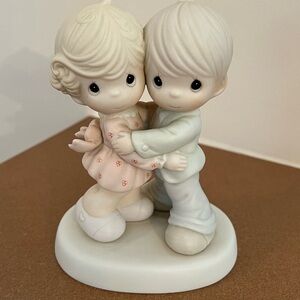 Precious Moments Figurine with Pastel Accents
“HUG ONE ANOTHER”